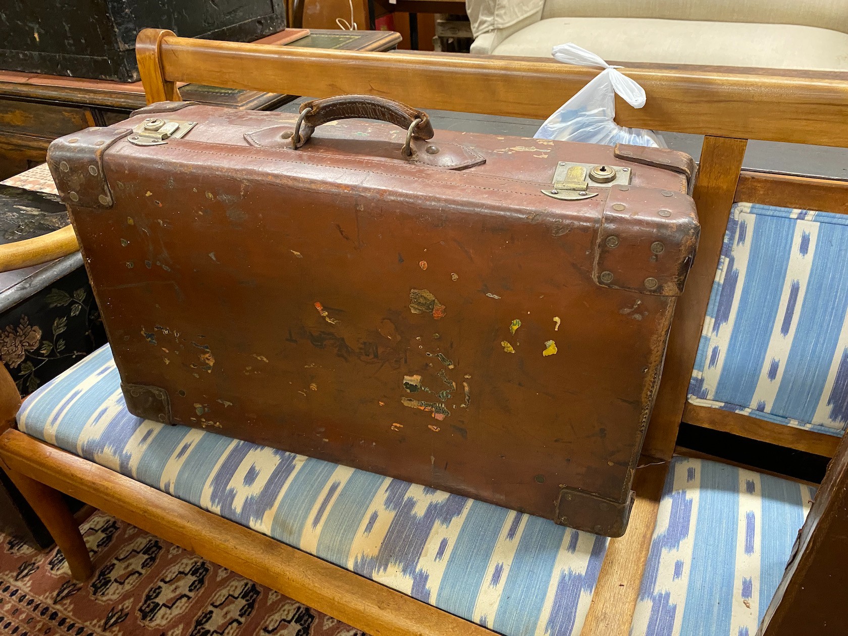 Four vintage suitcases, largest 82 x 53cm